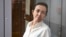 TOPSHOT - Alsu Kurmasheva, a US-Russian journalist for Radio Free Europe/Radio Liberty (RFE/RL) who was arrested last year for failing to register as a "foreign agent", attends a hearing on the extention of her pre-trial detention, at the Sovetski court i
