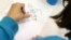 France -- A child draws in the Salle du Pont du Buy