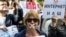 Russia -- A protester with tape covering her mouth takes part in the March for Free Internet in central Moscow, July 23, 2017